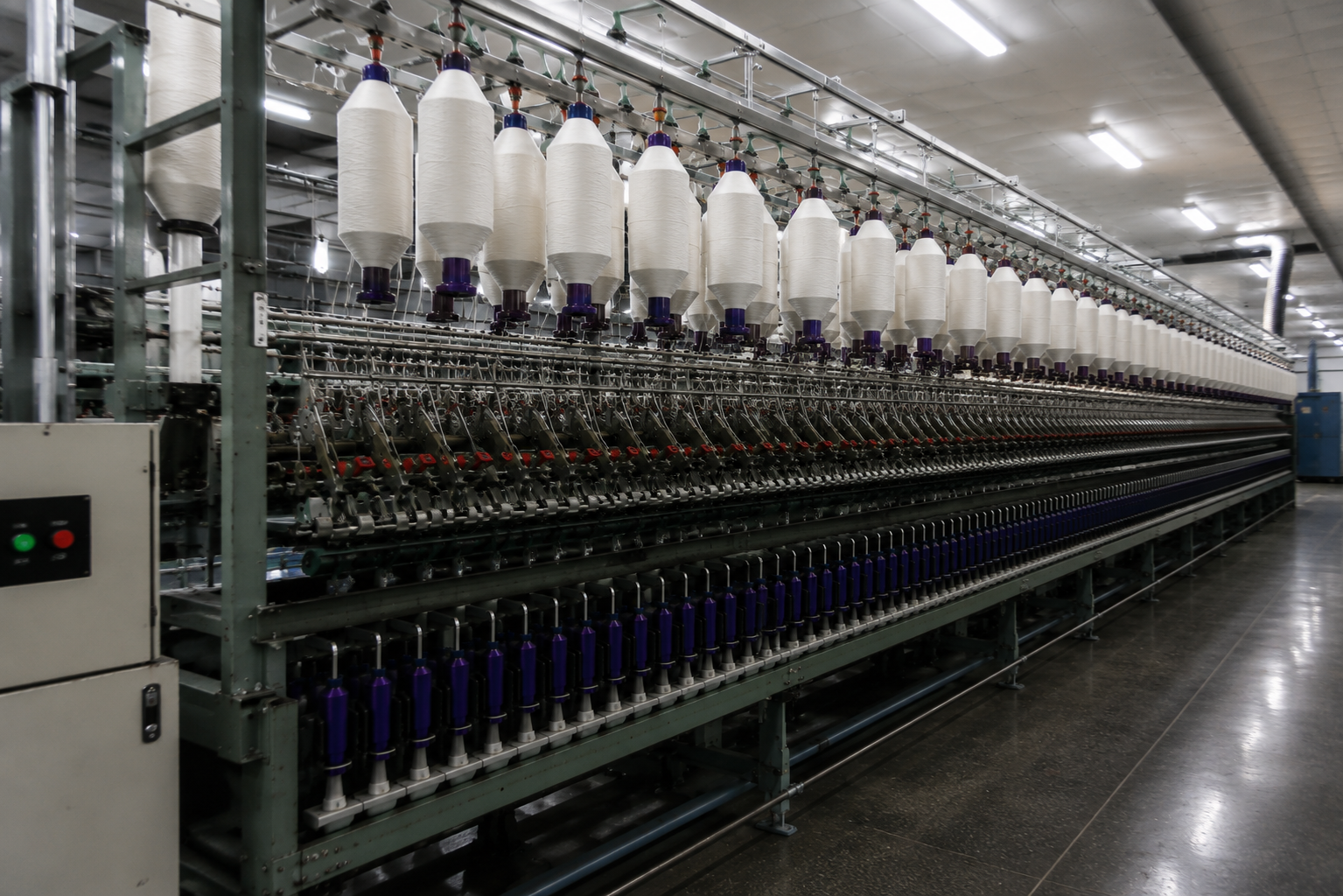 Spinning frames turning combed tops into fine worsted yarn.